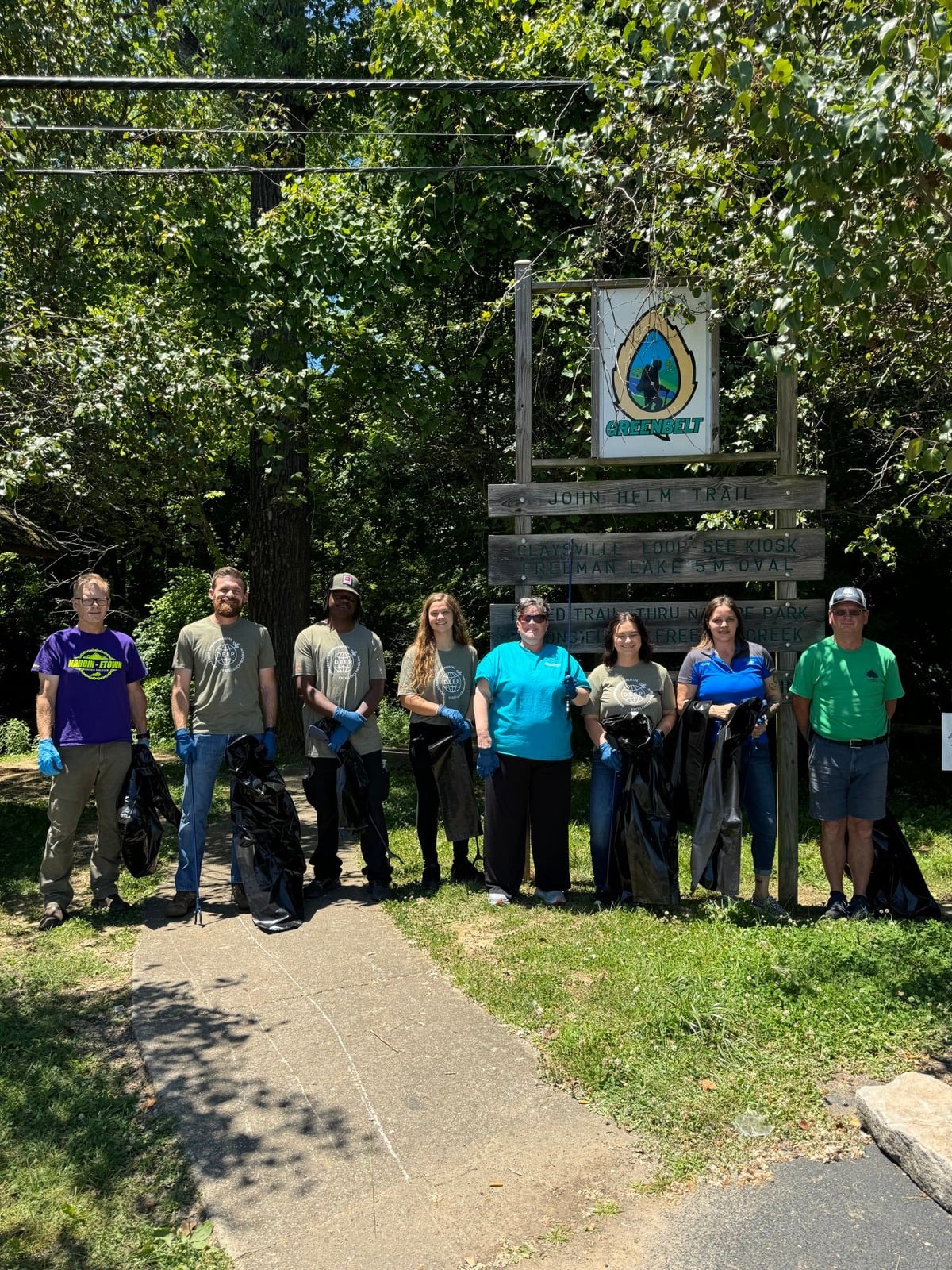 Swope employees and community partners gathered after a local trail cleanup